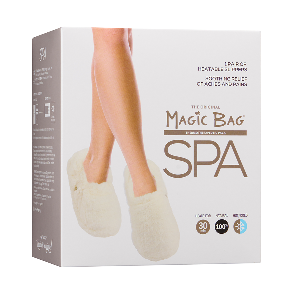 Magic Bag SPA Ivory Plush Heatable Slippers in box with image of slippers worn; soothing comfort for cold floors and aches.